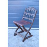 A heavily carved chair with an upholstered seat in the Wainscot style. Generally good condition,
