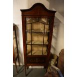 Edwardian inlaid mahogany and glass display cabinet. There is a crack to one leg. worm is