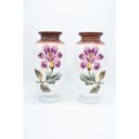 A large pair of white opaline glass vases with floral decoration. Wear and losses to the paint. Some