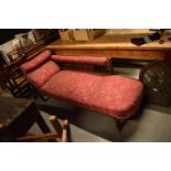 Edwardian upholstered mahogany chaise-longue. The springs have gone spongey. Damage to the carving