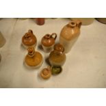 A collection of stoneware to include flagons, jugs, chicken feeder etc (6) Mixed condition