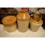 A large stoneware jug, jar and churn (3) The churn is cracked, All are as expected with some issues,