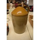 Antique 4 gallon stoneware jar. The stoneware's condition is as expected with some scratches and