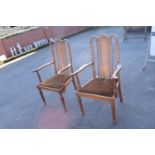 Pair of Edwardian upholstered chairs (one has been cracked across the front legs though it can still