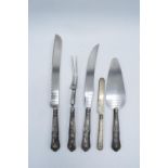 A collection of silver collared cutlery together with a silver knife (London mid 1800s, 46 grams