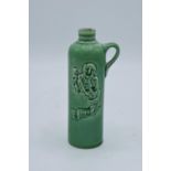 Small green stoneware flagon "Hulstkamp'. In good condition with some crazing. 14cm tall