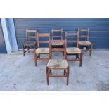 A collection of 6 Victorian ladder back farmhouse chairs with rush seats (All near matching) (6). In