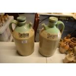 A near pair of Stargene stoneware pouring jugs 'Deposit 2/6'. In clean condition with some surface