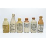 A collection of stoneware bottles to include Thompsons, Lawrance, Dirrie, Hammond, CAMWAL and