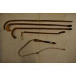 A collection of sticks to include a riding crop, a horn dog whistle etc. Some damages.