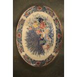 Large early 20th century unmarked peacock themed meat plate. In good condition with some signs of