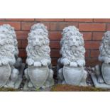 Reconstituted stone small pair of upright lions. 41cm tall. Made in England, these items are frost