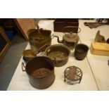 A mixed collection of metalware to include brass coal bucket, fireside trivet, brass saucepans