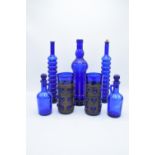 A good collection of vintage blue glass items to include vases, decanters, jugs etc. No postage.