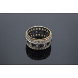 Silver eternity ring with blue and white stones. Gross weight 5.8 grams.