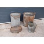 A collection of early 20th century tin bins, anti spill milking bucket and a mesh sorting bucket