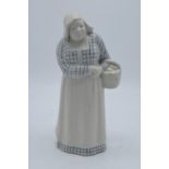 Doulton Lambeth stoneware figure of a Dutch woman with basket, H3. In good condition with no obvious