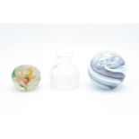 A boxed paperweight together with a smaller example and a Stuart Crystal miniature vase.