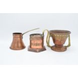 Edwardian copper chamberstick, a copper arts and craft footed bowl by Fisher and Strand together