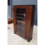 Large Victorian mahogany bookcase on carved feet with foldout sides and a glass panelled door. 3