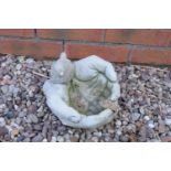 Reconstituted stone model of a bird in hand birdbath. Made in England, these items are frost and