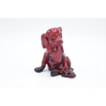 Royal Doulton flambe model of a seated puppy HN128. Some light scratches. In good condition with