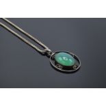 Silver necklace with a green stone pendant