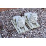 Reconstituted stone models of lions laying down. Made in England, these items are frost and