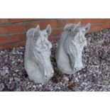 Reconstituted stone pair of horses heads. 35cm tall. Made in England, these items are frost and