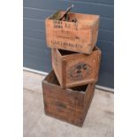 A collection of wooden advertising crates plus an iron with fuel. 50 x 40 x 44cm largest.