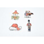 Lorna Bailey Christmas tree decorations to include a robin, a candle, a Santa hat and a toy