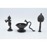 A collection of antique Oriental/ Asian bronze items to include a lamp, a figure of a goddess and an