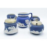 A collection of Adams of Tunstall blue jasperware to include condiment pots and a jug(5). In good