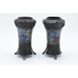 A pair of art-nouveau metal vases each on tri-legs with cloisonné style decoration. Signs of wear