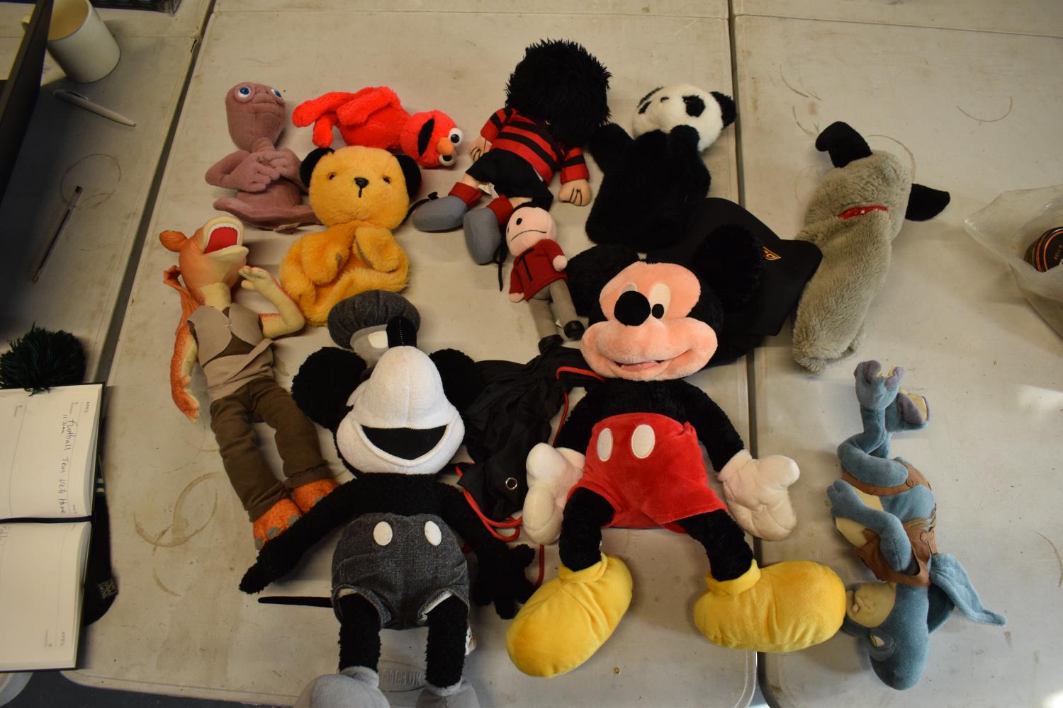 A collection of cuddly toys to include Dennis the Menace, Star Wars, Mickey Mouse etc.