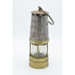 Johnson Clapham and Morris brass minors lamp. Some signs of wear and tear as expected. 24cm tall.