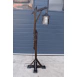 A 20th century/ modern freestanding wooden lamp base in the style of an 18th century tavern/
