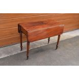 Late 19th century mahogany Pembroke table on casters with a single hidden draw. In good functional
