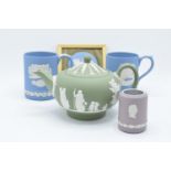 A collection of Wedgwood Jasper ware to include a lilac vase/ table lighter, a sage green teapot (