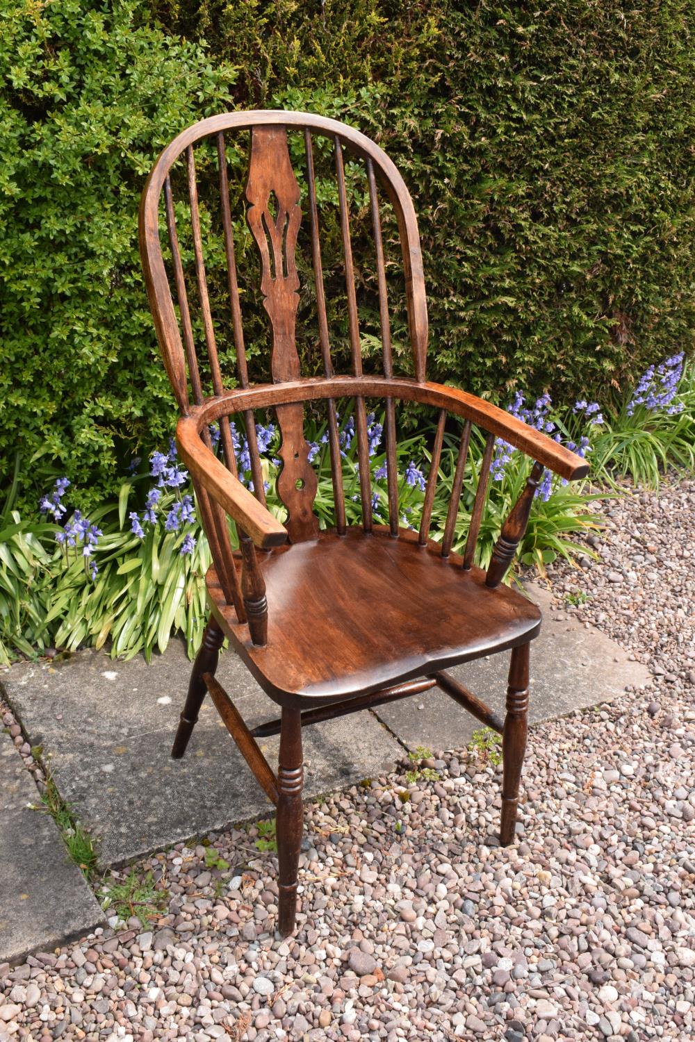 A 19th century Windsor farmhouse armchair. In good condition with age related wear and tear to