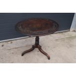 Georgian thick oak oval tilt top table with later Victorian carving depicting fruit scenes. 84 x