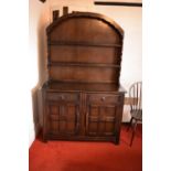 Wooden 20th century priory style Dutch dresser. In good condition with age related wear and tear