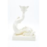 Wedgwood and Bentley cream ware dolphin candlestick. In good condition with no obvious damage or