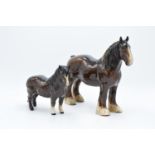 Royal Doulton (Beswick) brown shire 818 and a brown Shetland pony DA47 (2). In good condition with