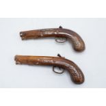 A near pair of Doulton and Watts salt glaze duelling pistol spirit flasks, circa 1840s. Both present