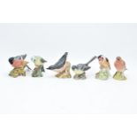 A collection of Beswick birds to include a Bluetit, Bullfinch, Robin, Nuthatch, Grey Wagtail and