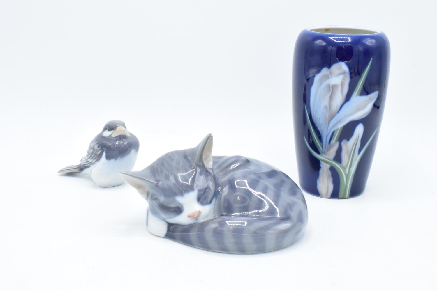 A collection of Royal Copenhagen to include a sleeping cat 057, a bird 107 and a floral vase 1590/