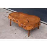 Mid century tree slice coffee table. 82 x 50 x 29cm. Some knocks and scratches with general wear