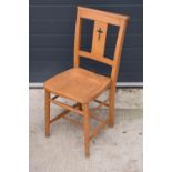 8 mid 20th century pine chapel chairs with a crucifix shape in the back. 86cm tall. Each in good