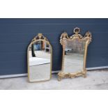 A pair of 20th century reproduction ornate wall mirrors, one metal and one wooden example (2).